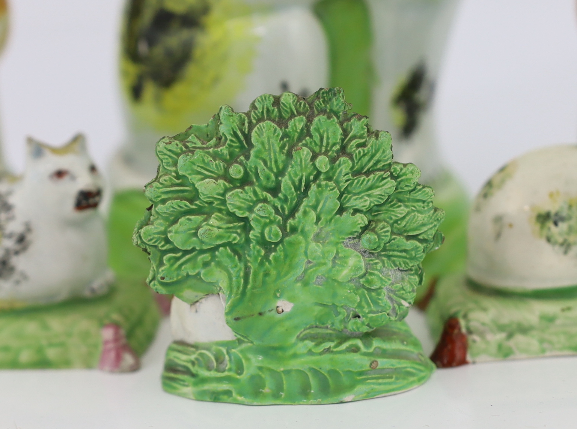 Six Staffordshire pearlware models of cats, early 19th century